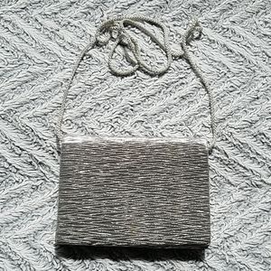 Pleated silver fabric bag